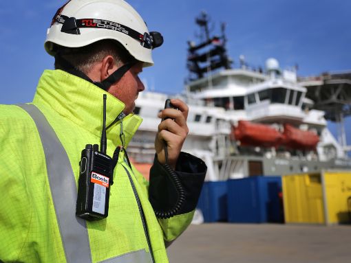 Staff member with a walkie-talkie
